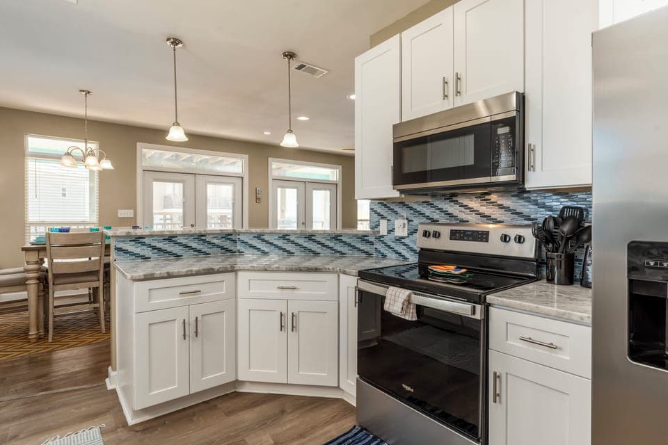 Your fully equipped kitchen features modern appliances and granite countertops, perfect for preparing meals during your stay.