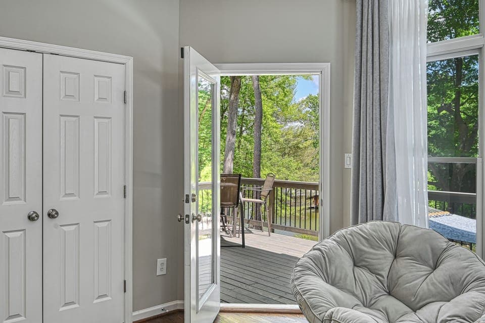 "Lakeside Retreat" master with access to the wraparound deck.