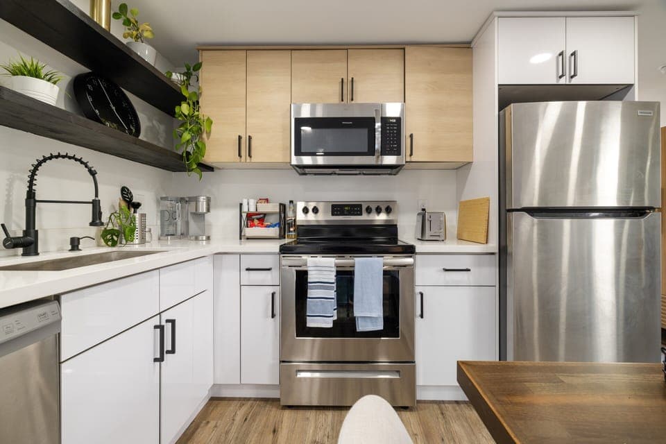 Full sized kitchen with dishwasher, oven, microwave and full sized fridge