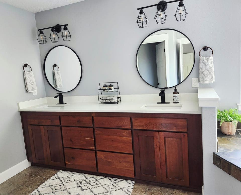 Owners' bathroom with tub, shower, and double vanity 