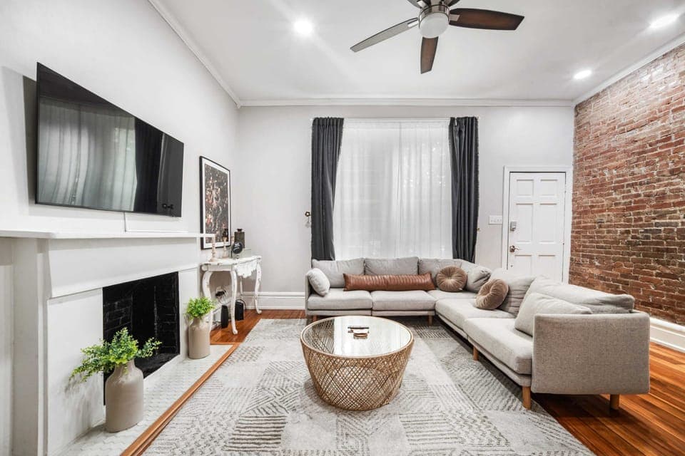 Living Room: The living room features a plush sofa and TV, creating a perfect space to unwind and enjoy your favorite shows in comfort.