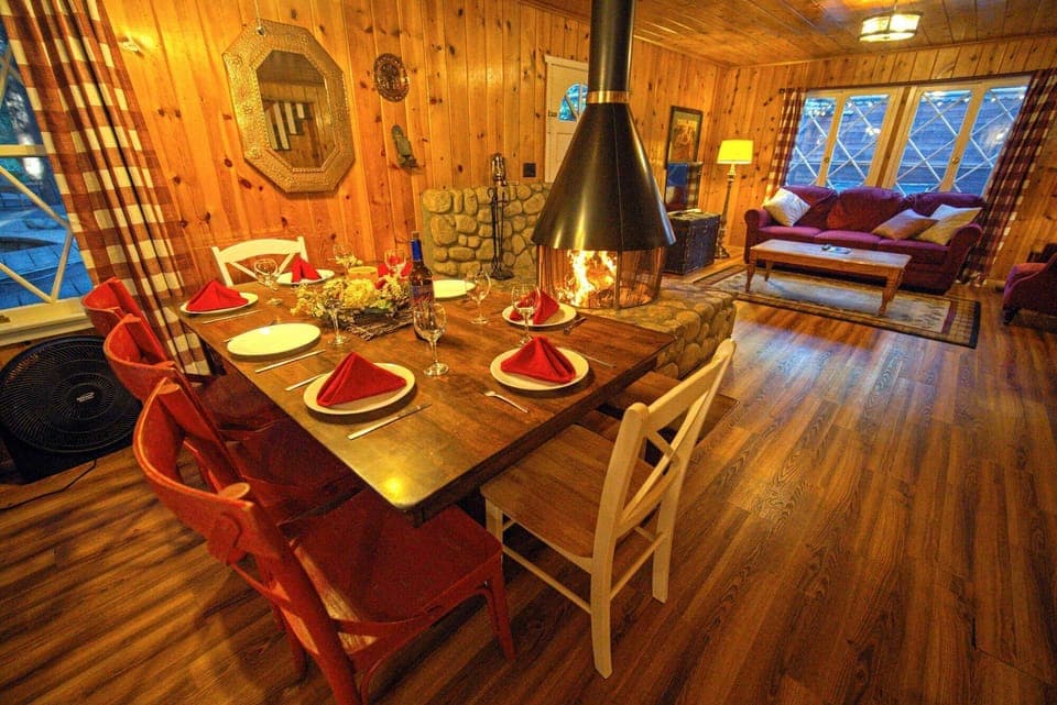 Dining room and living room with real wood-burning fireplace