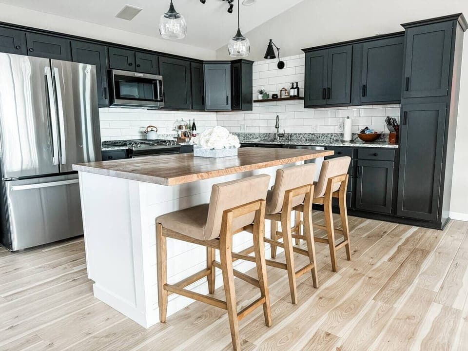 Fully stocked kitchen equipped with stainless steel appliances, dishwasher, crockpot, waffle iron, griddle  and more! 