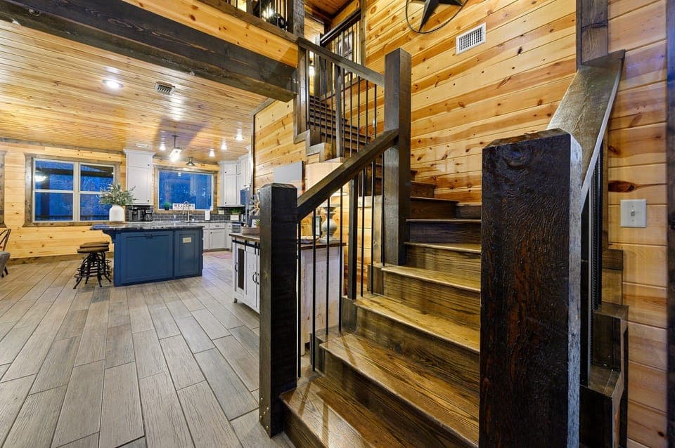 Up this staircase we'll find the other 4 bedrooms and additional bathrooms.