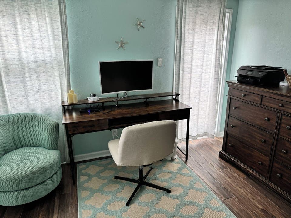 Office space in master bedroom. Printer, docking station, mouse, keyboard