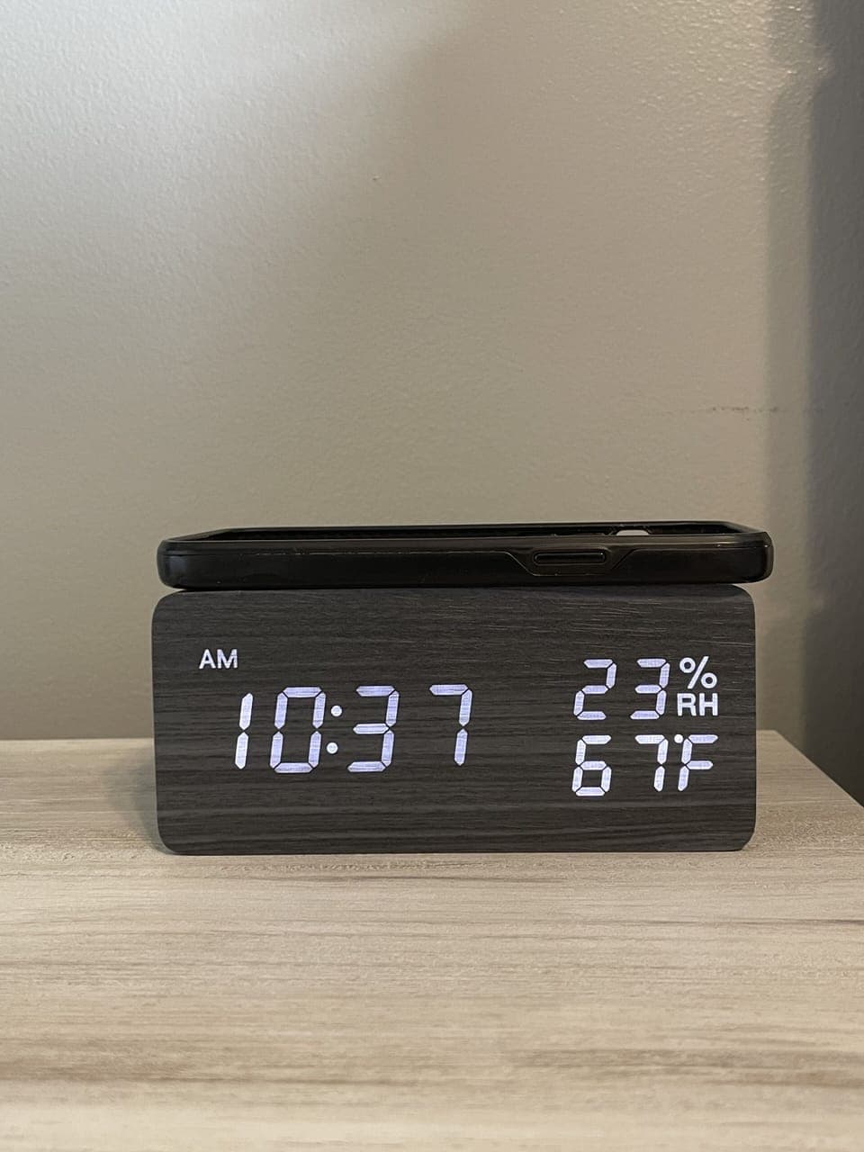 There are alarm clocks in all the bedrooms that are also wireless phone chargers too.  No need to even get your charger out!
