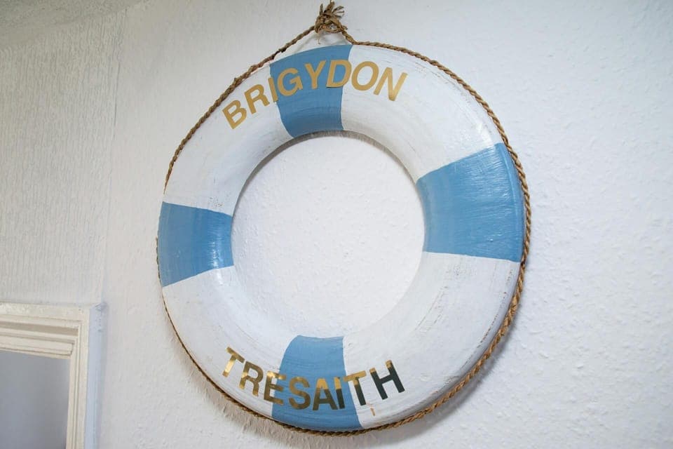 Ornamental buoy with the cottage name on