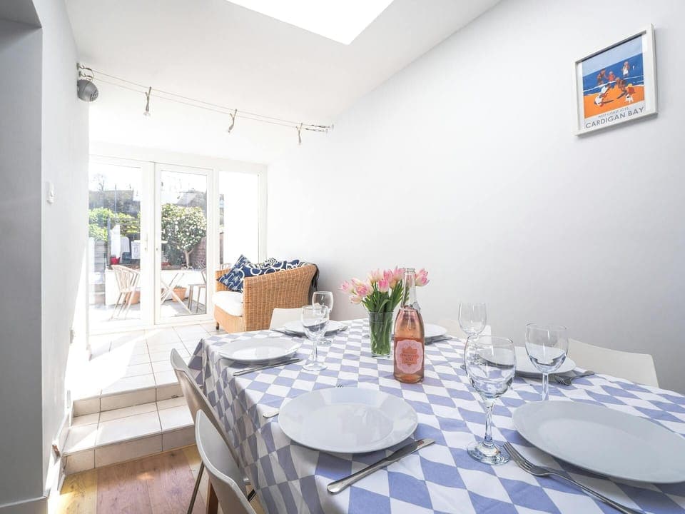 Dining area leading to French doors and the patio area