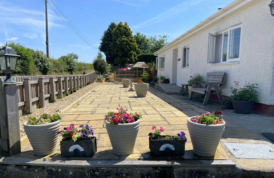 exterior patio with plant pots around the edges