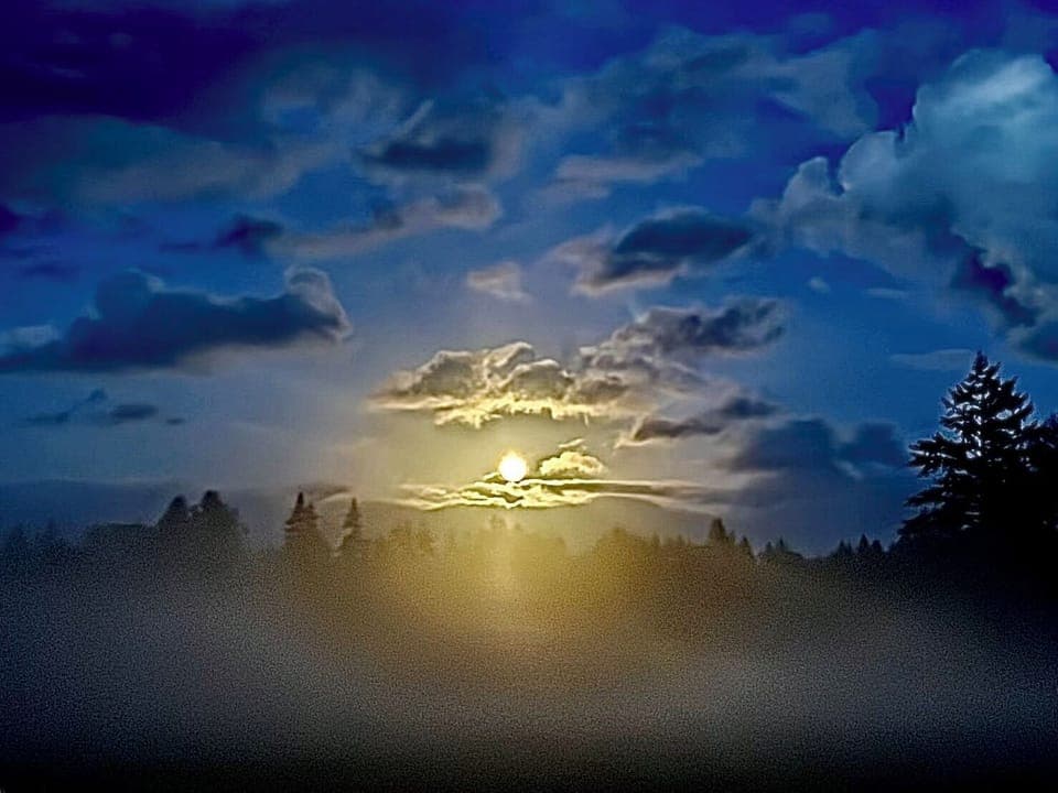 Full moon across from the airport 3 miles away