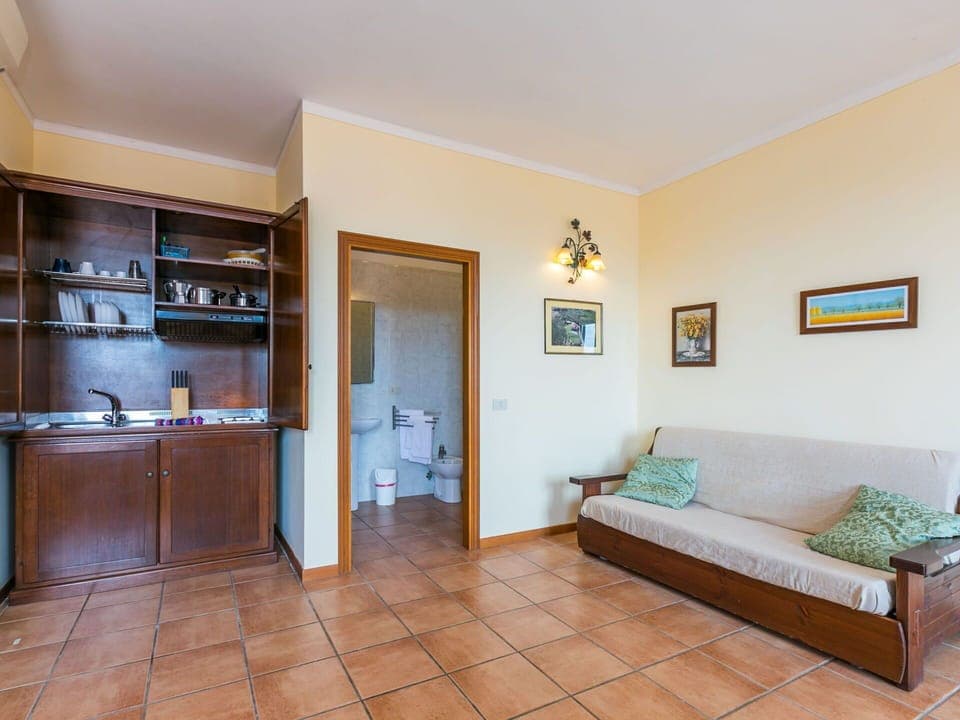 Furniture, Property, Cabinetry, Couch, Picture Frame, Countertop, Shelf, Interior Design, Wood, Flooring