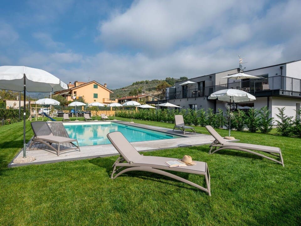 Cloud, Sky, Plant, Swimming Pool, Building, Sunlounger, Outdoor Furniture, Land Lot, Shade, Grass