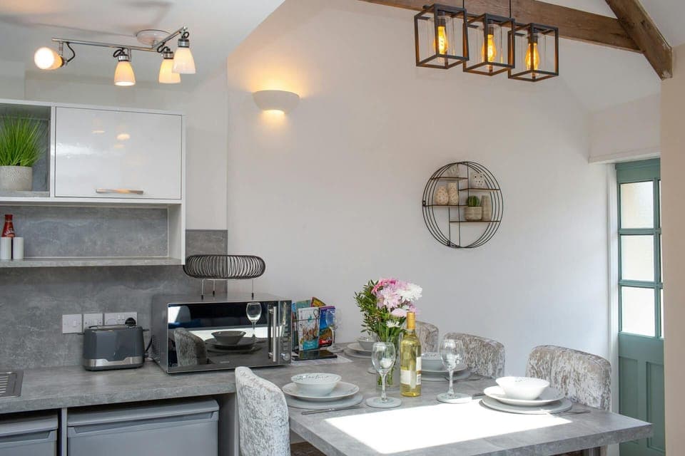 Front door leading to kitchen area. Original A frame beams