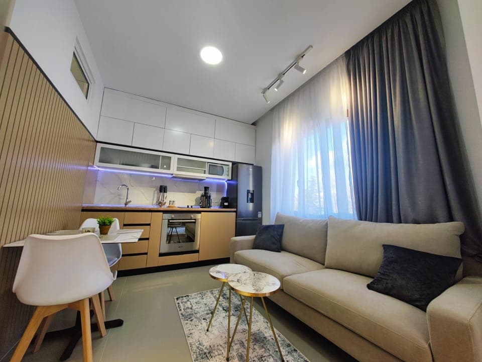 Stylish sitting area with warm lighting and wood details