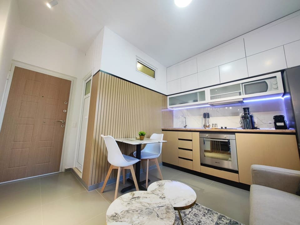 Open-plan living space with sofa and dining area

