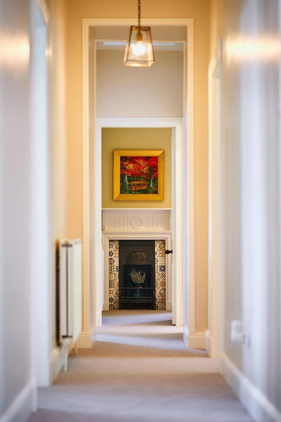 Beech bedroom traditional fireplace and original painting of surrounding trees.