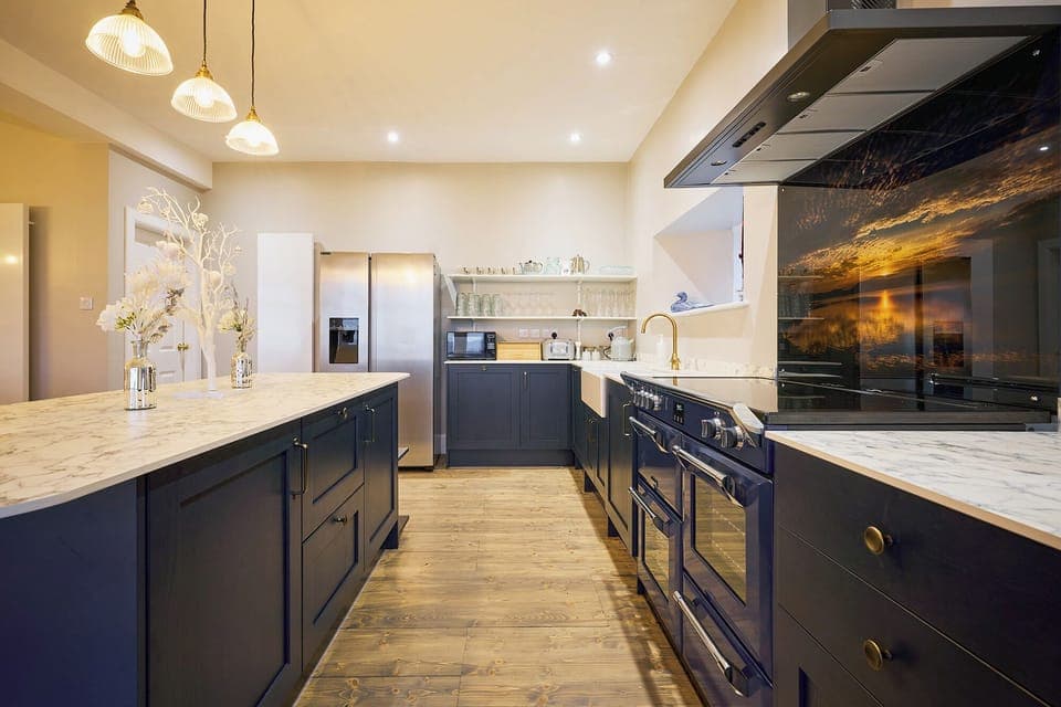 Spacious and modern fully equipped kitchen with four-oven range cooker