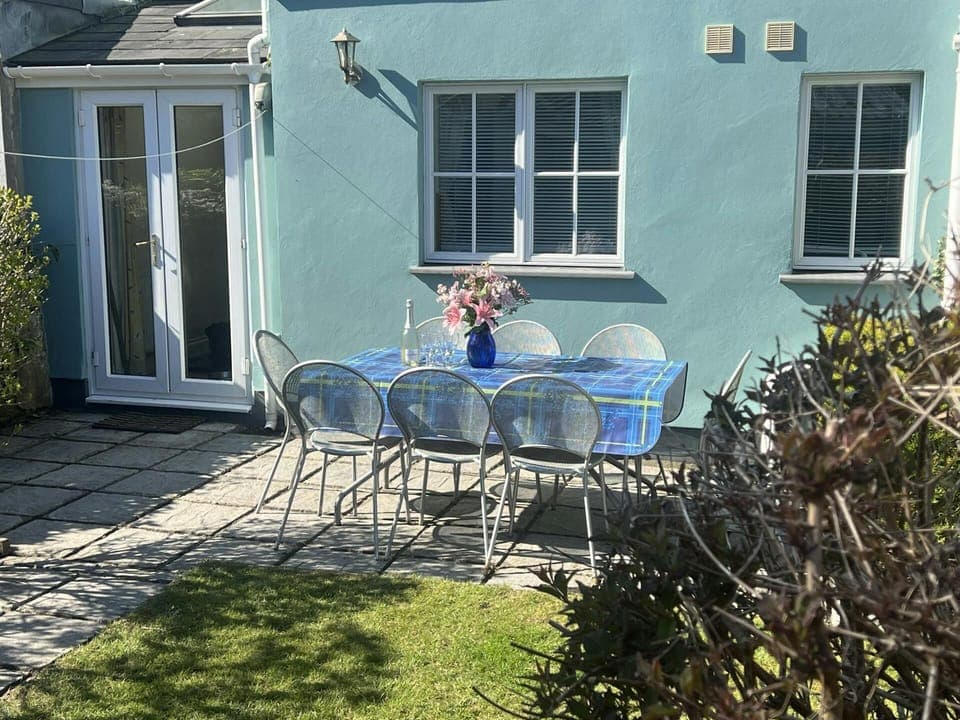Outdoor seating area with table and eight chairs