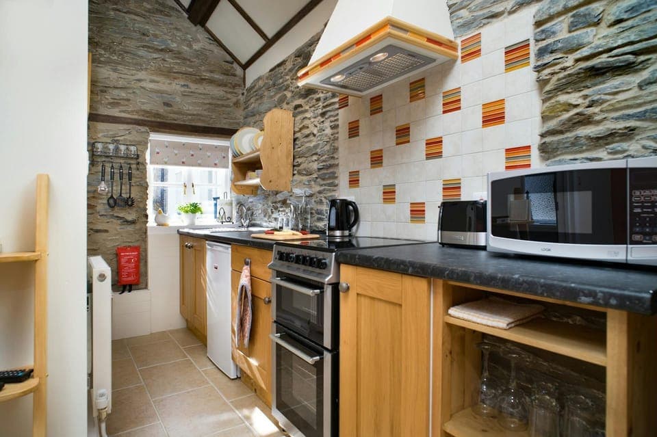 Fitted units, cooker, fridge, sink, microwave and window