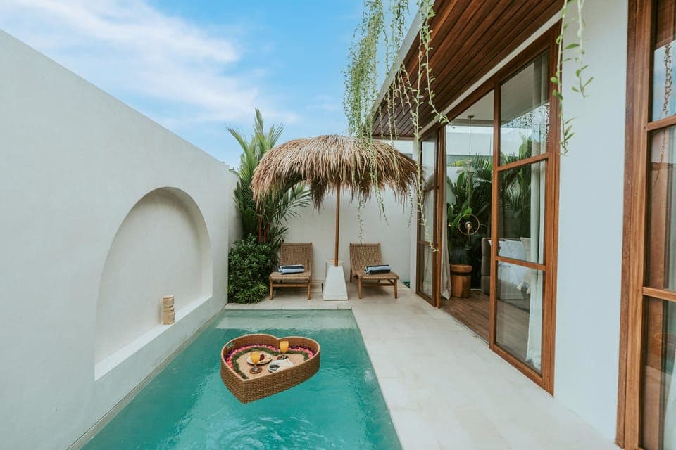 Sparkling private pool with sun loungers, perfect for ultimate relaxation.