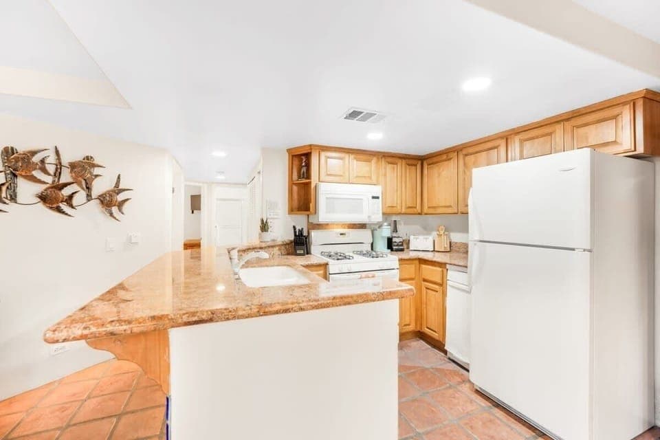 Open concept kitchen stocked with cooking essentials!