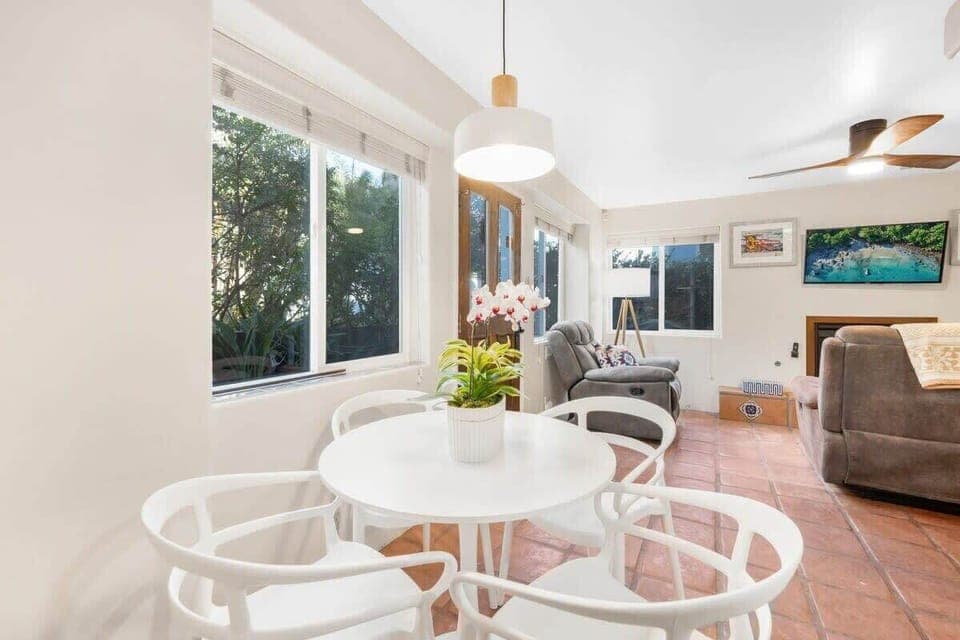 Cozy dining area for four people in the open concept living space. 