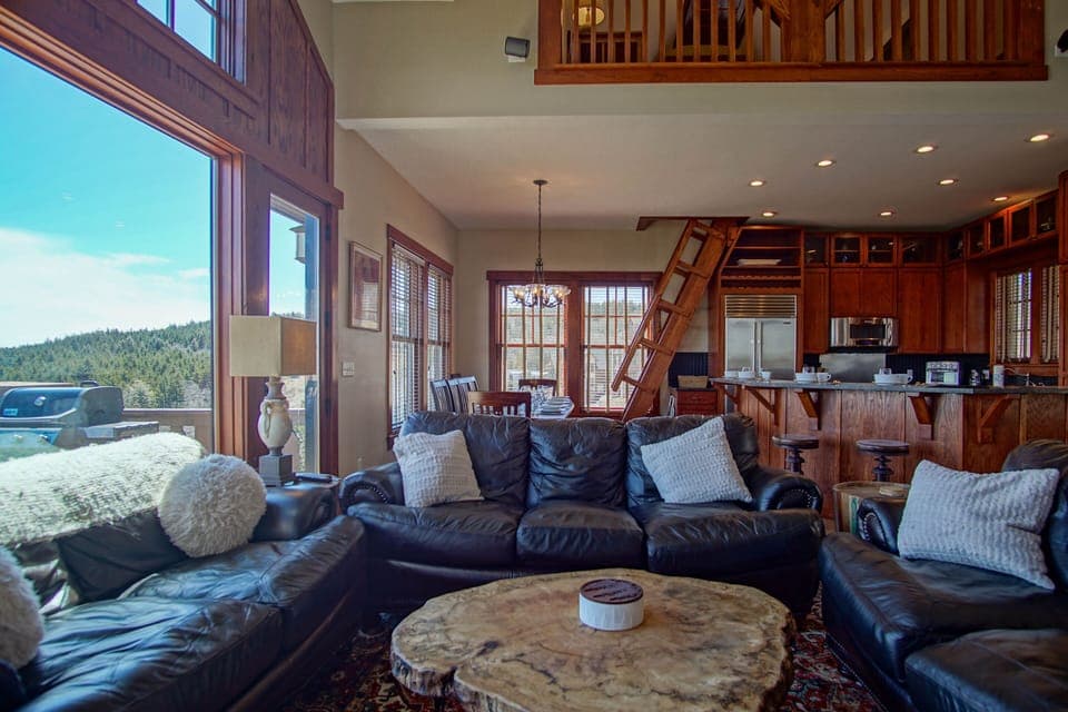 From the warmth of the fireplace, the entire open-concept fourth floor unfolds before you.