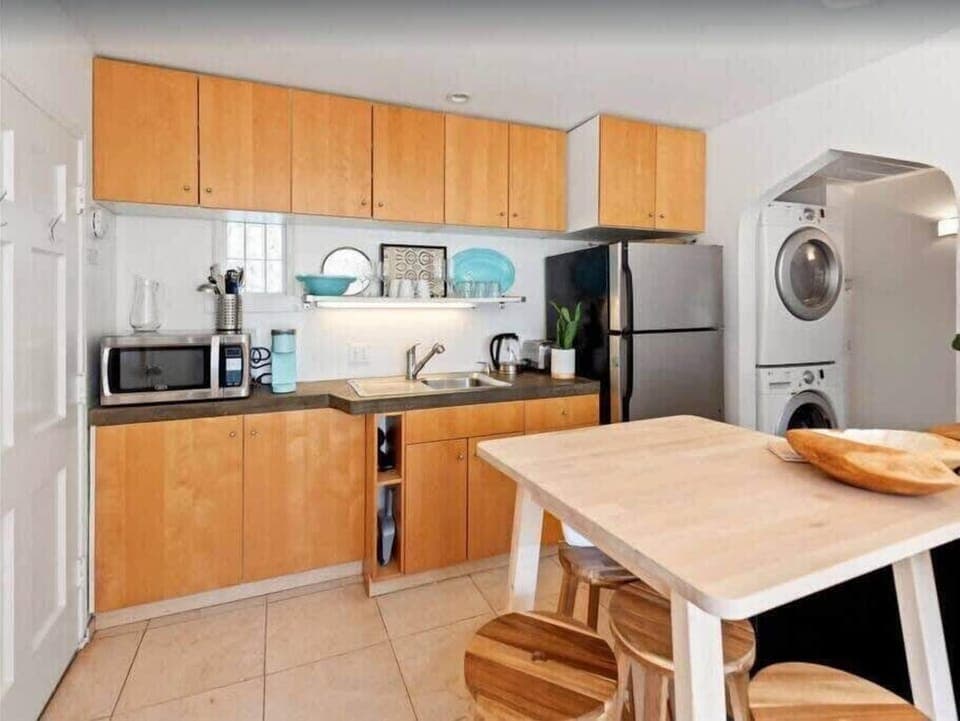 Kitchen is located right as you enter the home.  It has all kitchen essentials needed for a comfortable stay. 
Keurig Coffee machine and coffee provided. 