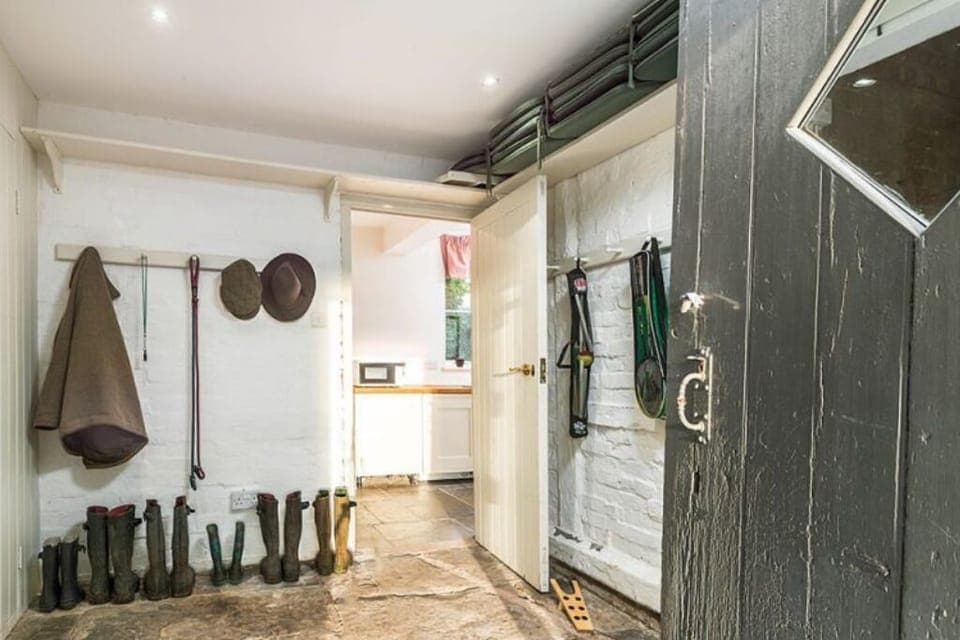 The boot room with plenty of space for coats wellies 2 dog crates and sports bag