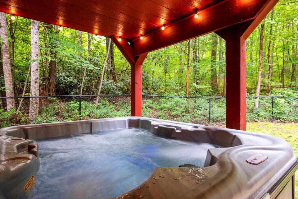 The private hot tub is fully covered and also includes LED lights.