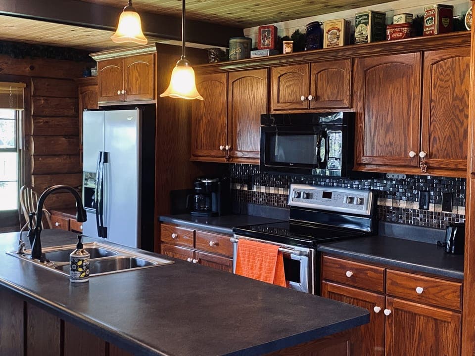 Kitchen includes refrigerator, oven, dishwasher, microwave, toaster & coffee pot