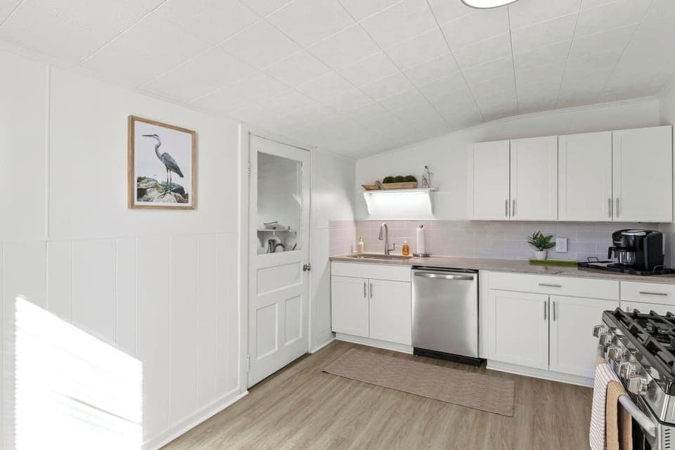 Savor the simplicity of our fully-equipped kitchen with sleek, stainless steel appliances and a fresh, clean design.