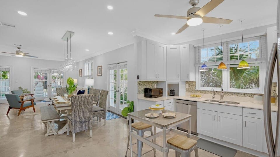 The living room, dining room, and kitchen flow as one space...