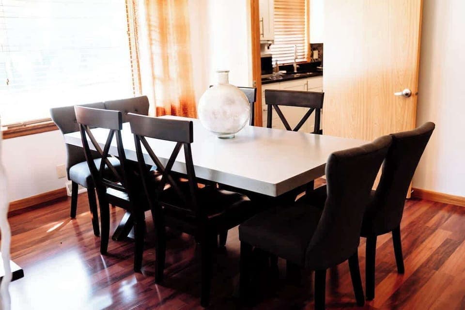 Setting the stage for shared moments and delicious meals. The perfect space for an intimate dinner or lively conversation. Located just steps away from the kitchen, culinary delights are easily served with convenience