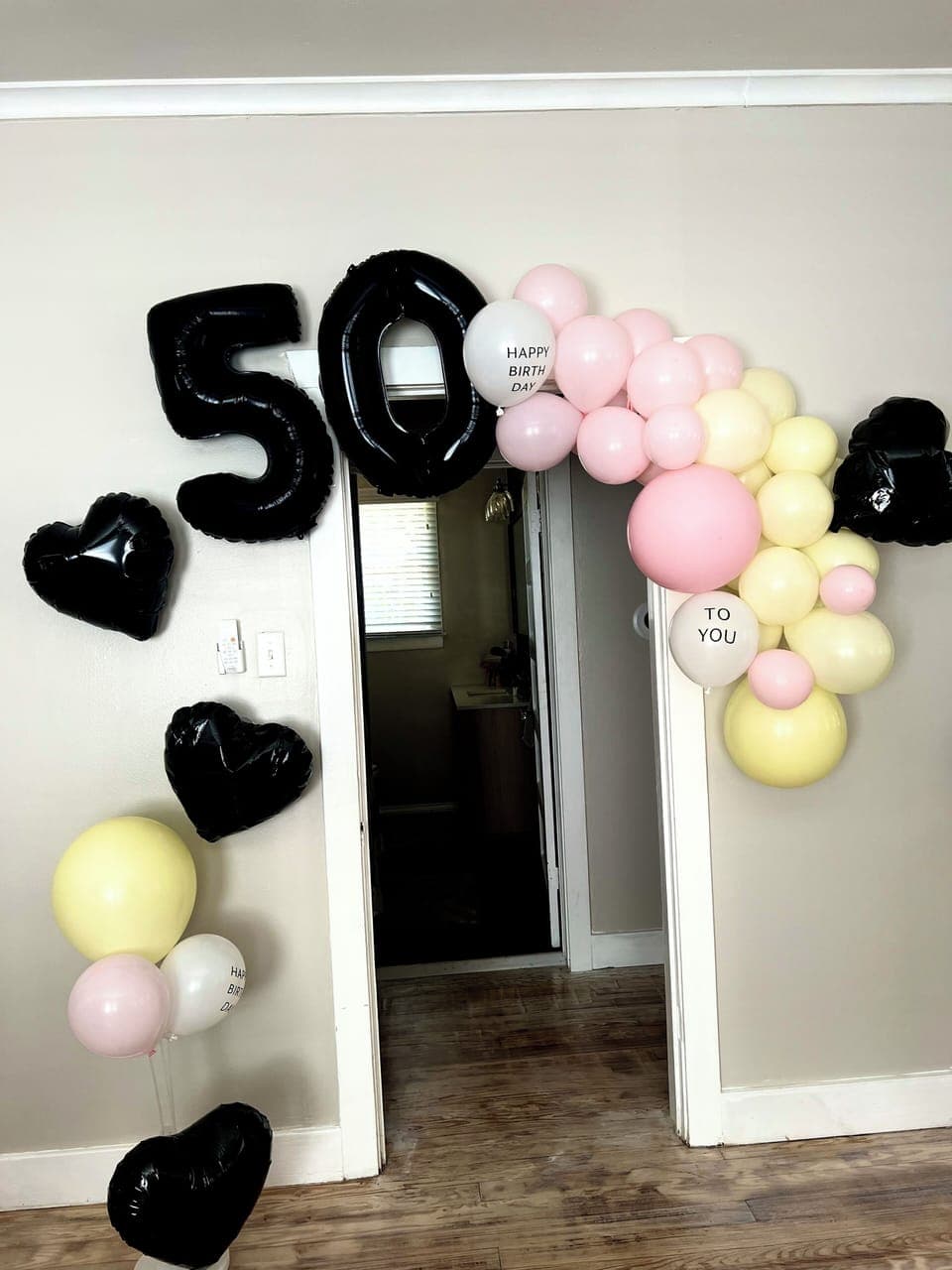 Special event package: balloon arches, cake, champagne, rose petals,letter board