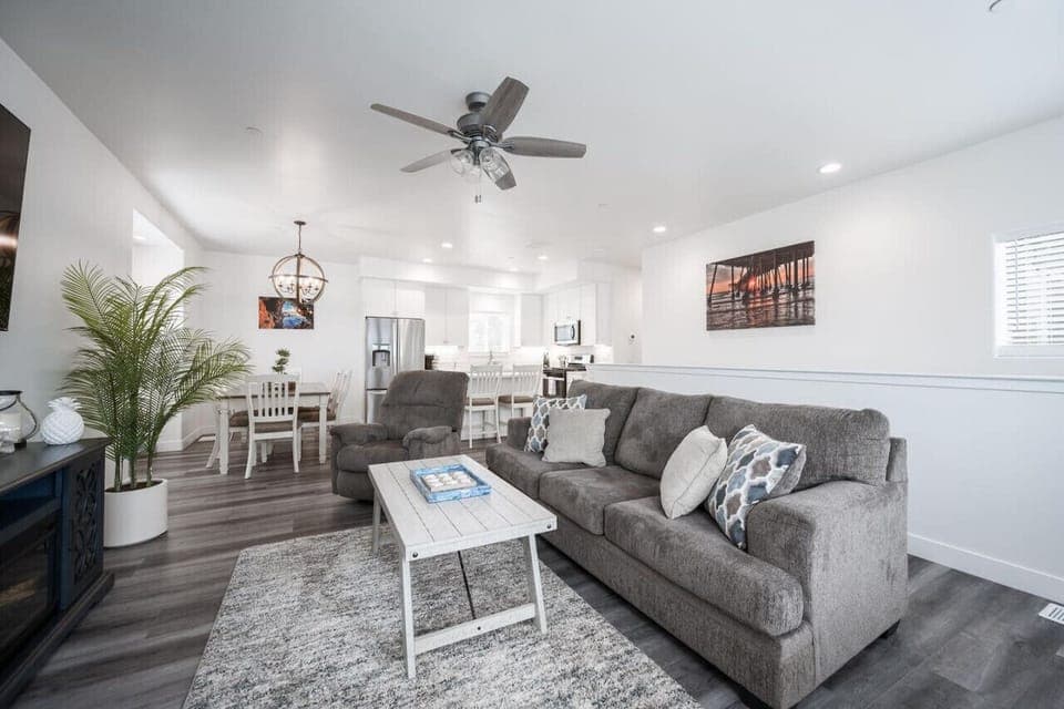 Upstairs living room with pull out queen sofa bed, fireplace and smart tv.