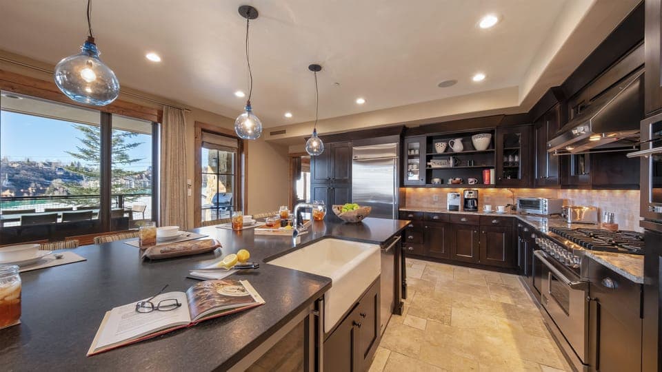Kitchen, Main Level - Open layout with bar seating and views