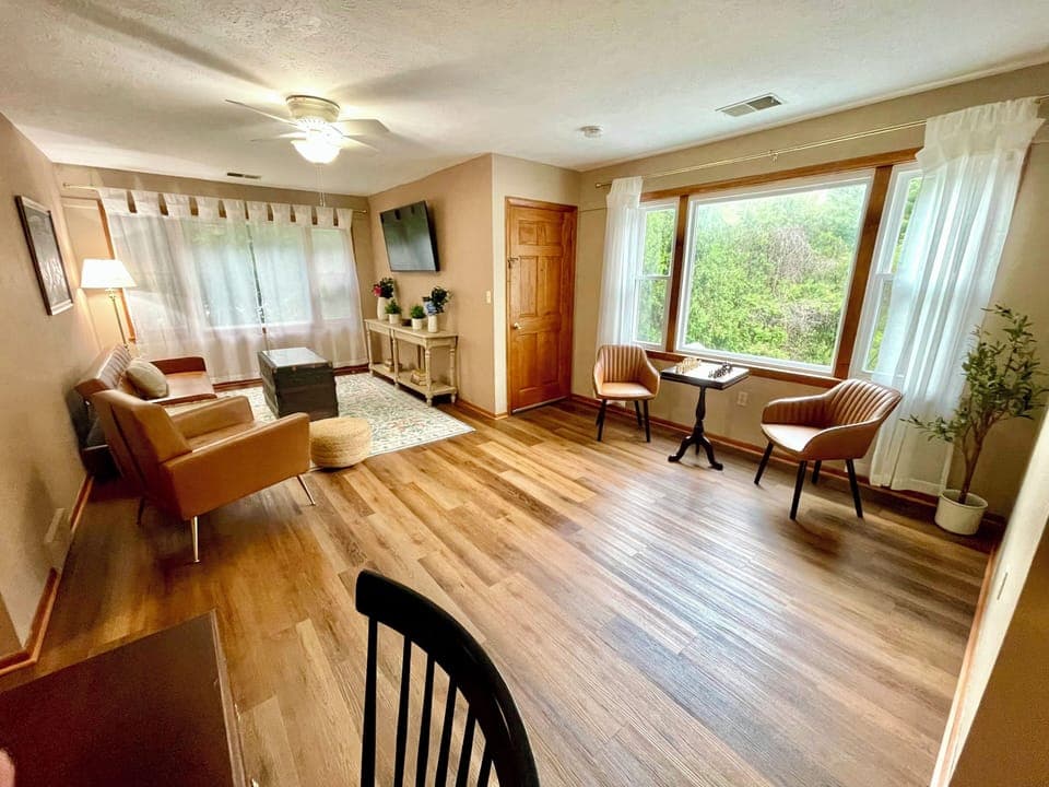 Spacious, beautifully designed living room with two huge picture windows. 