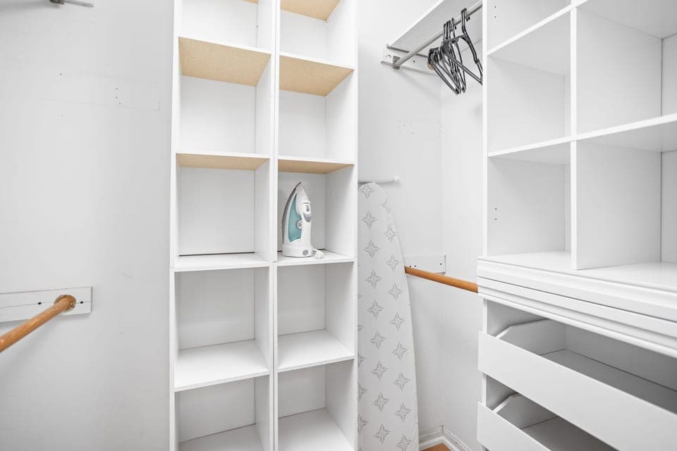 Discover convenience and organization in our closet, complete with an iron, ironing board, and hangers for your use.