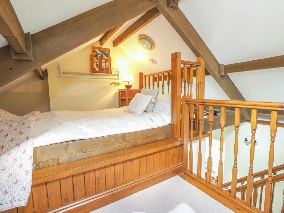 Single bedroom with bedside table and lamp