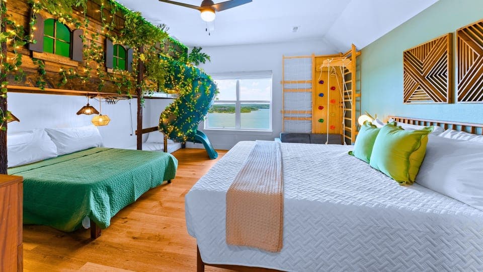 Into the Forest includes 7 fun, themed bedrooms including this cabin bunk bed with tube slide + amazing lake views!