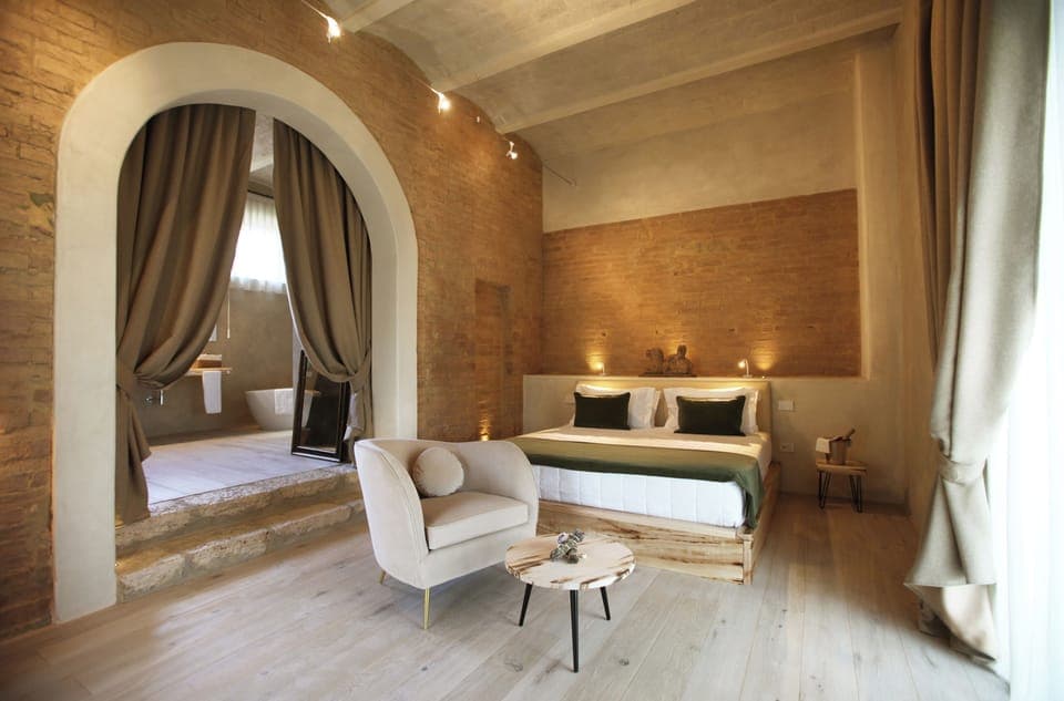 Deluxe Room, Patio, Garden View | Minibar, in-room safe, desk, laptop workspace