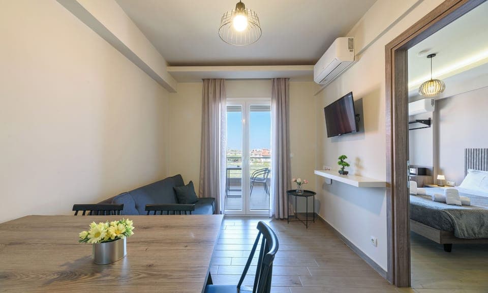 Family Apartment, Garden View | Living area | 43-inch Smart TV with satellite channels