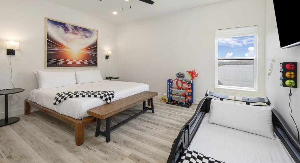 Sports Suite - Upper Level: Bedroom 7 w/ king bed, a race-car bed with twin bed, and ensuite bathroom