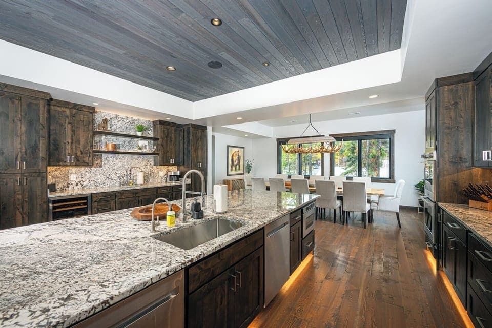 The executive kitchen features an expansive island with seating for 10 guests.