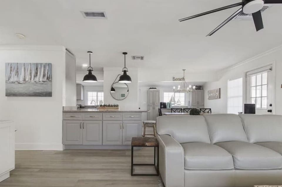 Relax in your open-concept living space where modern comfort meets coastal charm, complete with a fully-equipped kitchen for your culinary adventures.