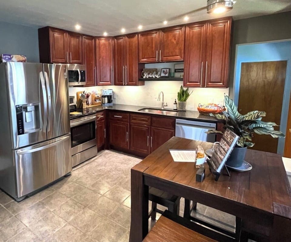 Beautiful kitchen is fully stocked.