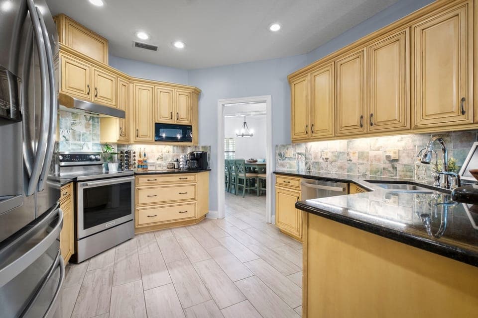 Kitchen is fully stocked for most cooking needs.