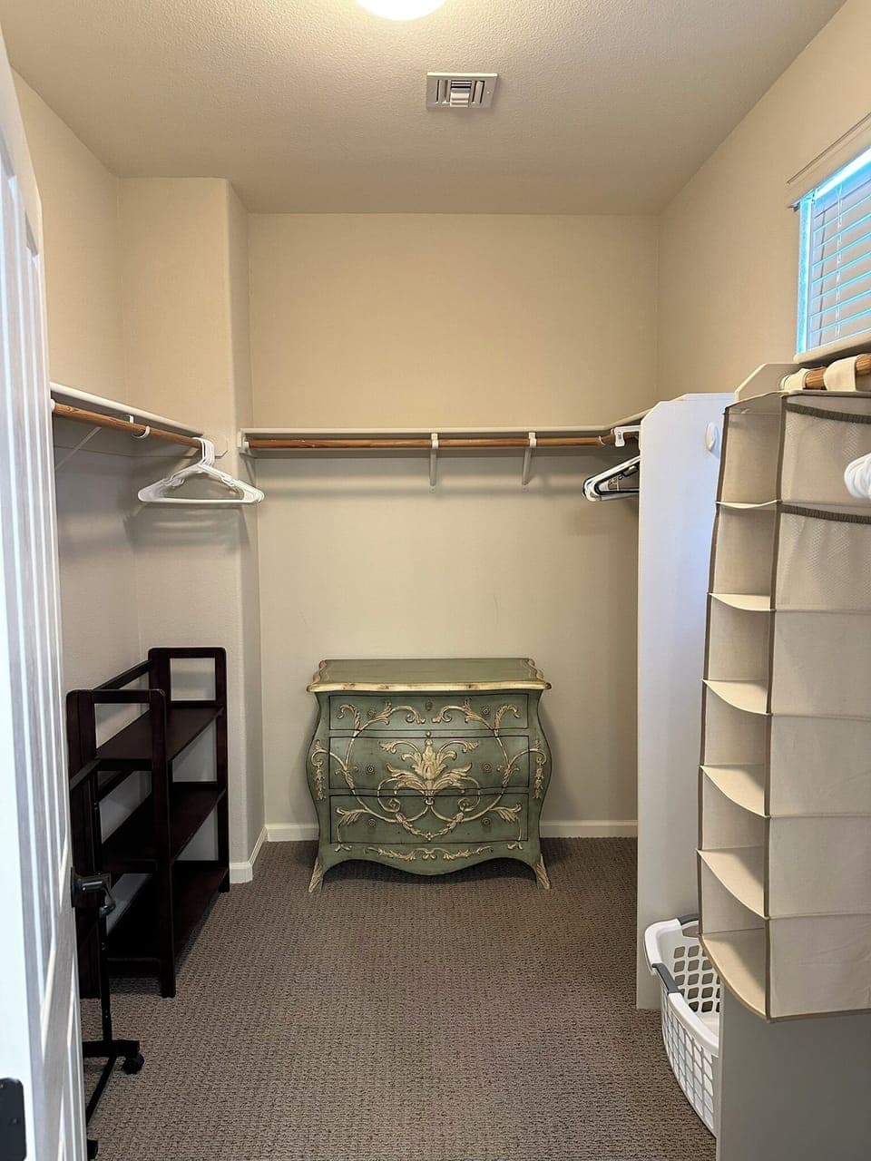 Walk-in closet in primary bedroom