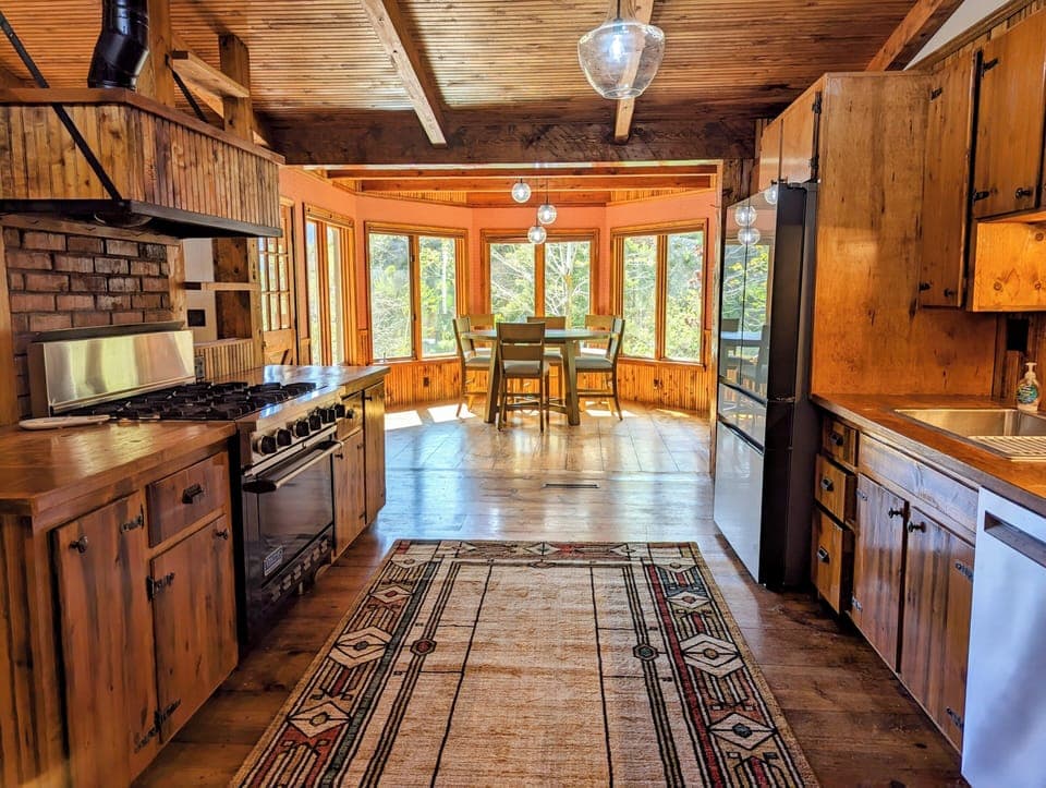 Open kitchen and dining room with views of Glenwood canyon and the Glenwood Arch